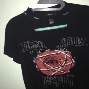 A black t shirt with flower and letter design